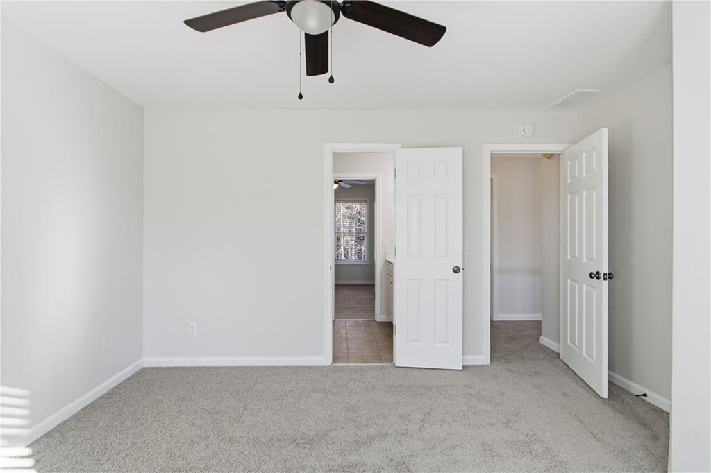 511 Highwater Pass Canton, GA 30114 - Photo 21 of 39 an empty room with a empty space and chandelier fan