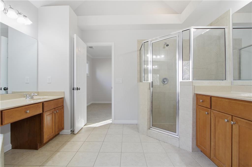 511 Highwater Pass Canton, GA 30114 - Photo 26 of 39 a bathroom with a shower and a sink