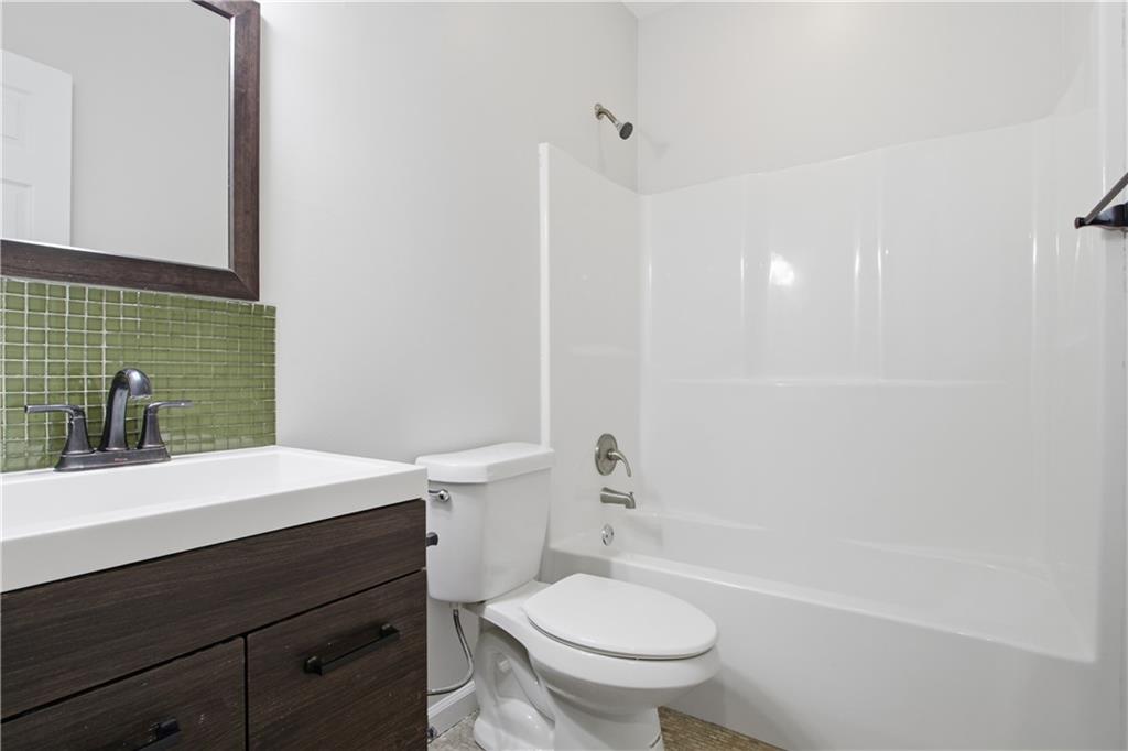 511 Highwater Pass Canton, GA 30114 - Photo 30 of 39 a bathroom with a sink a toilet and shower