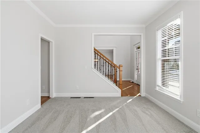 a view of a livingroom with a staircase