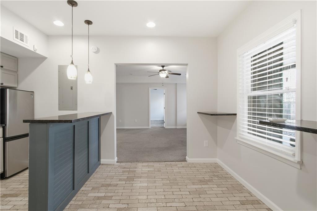511 Highwater Pass Canton, GA 30114 - Photo 31 of 39 a view of a kitchen with a refrigerator and a window