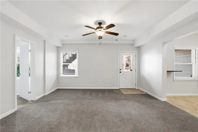 a view of a balcony with wooden floor and fence