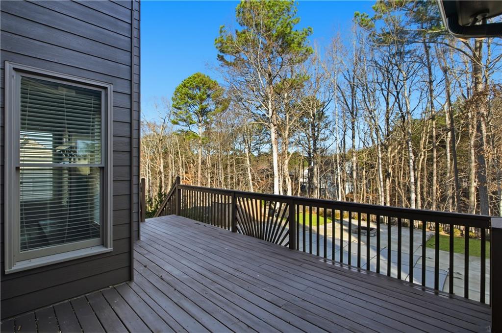 511 Highwater Pass Canton, GA 30114 - Photo 37 of 39 a view of a balcony with wooden floor and fence