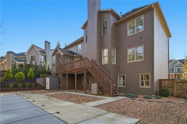a view of backyard with large trees