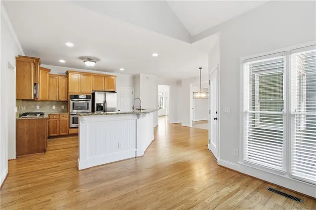 a view of kitchen with wooden floor