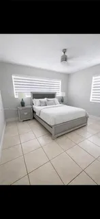 a living room with a black white checkered floor