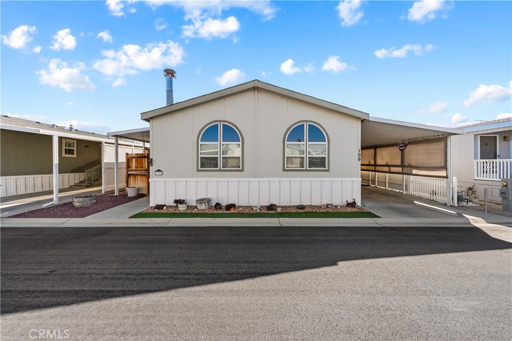 600 South Dennison, Unit 109 Tehachapi, CA 93561 - Photo 2 of 43 a front view of a house with a yard