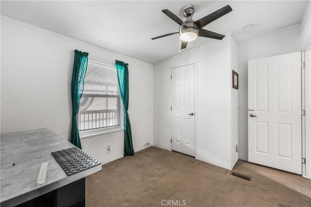 600 South Dennison, Unit 109 Tehachapi, CA 93561 - Photo 24 of 43 a view of livingroom with hardwood floor and a ceiling fan