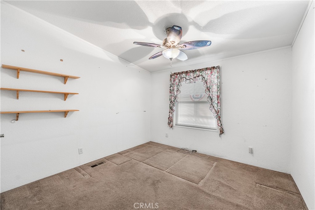 600 South Dennison, Unit 109 Tehachapi, CA 93561 - Photo 25 of 43 an empty room with windows and fan