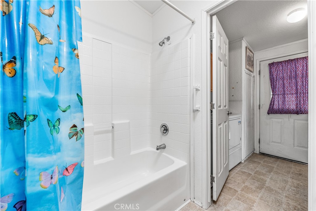 600 South Dennison, Unit 109 Tehachapi, CA 93561 - Photo 28 of 43 a bathroom with a bathtub and a shower