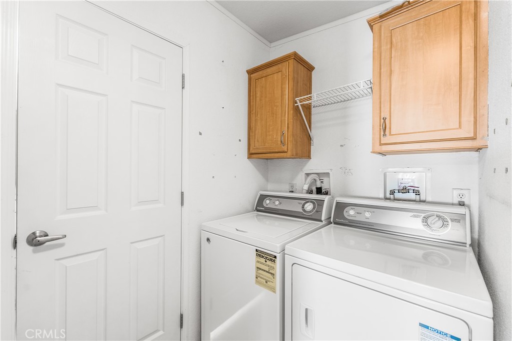 600 South Dennison, Unit 109 Tehachapi, CA 93561 - Photo 29 of 43 a view of washer and dryer with a utility room