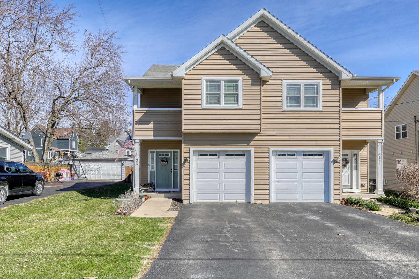 436 West Pierce Street Elburn, IL 60119 - Photo 2 of 28 a front view of a house with a yard and garage