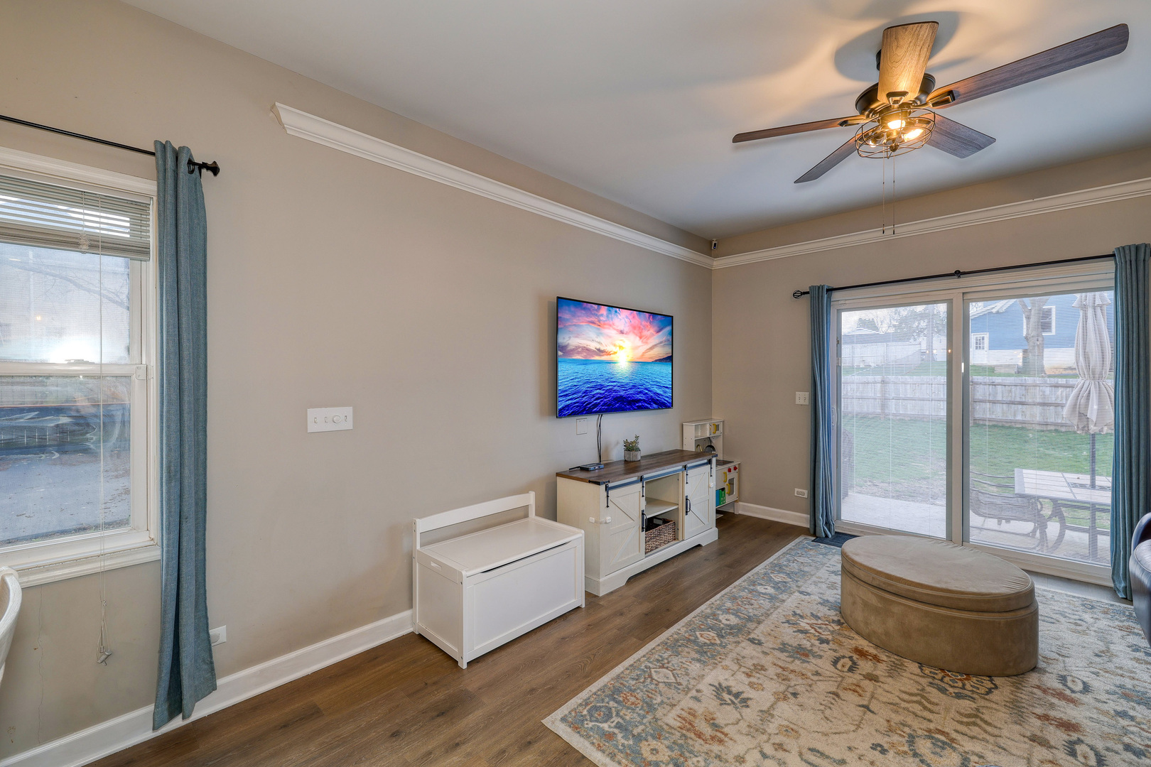 436 West Pierce Street Elburn, IL 60119 - Photo 7 of 28 a living room with furniture and a flat screen tv