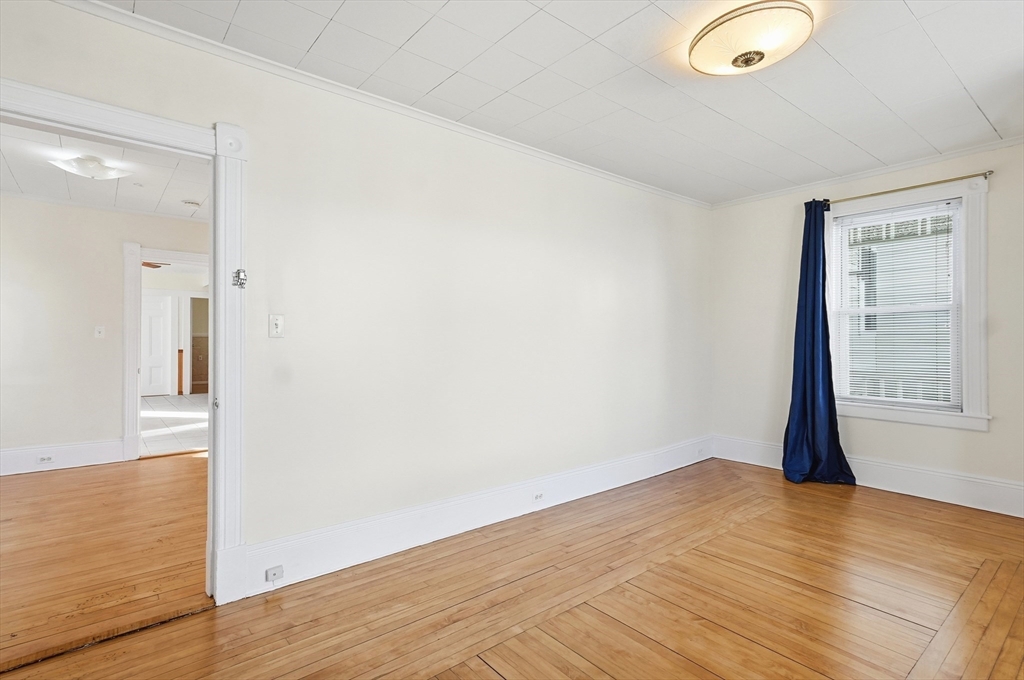 223 School Street, Unit 1 Lowell, MA 01854 - Photo 11 of 21 a view of empty room with wooden floor
