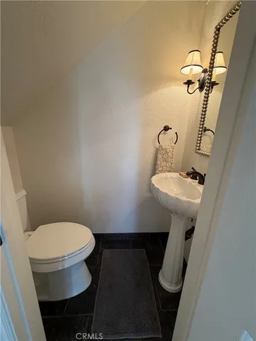 a bathroom with a sink toilet and tub