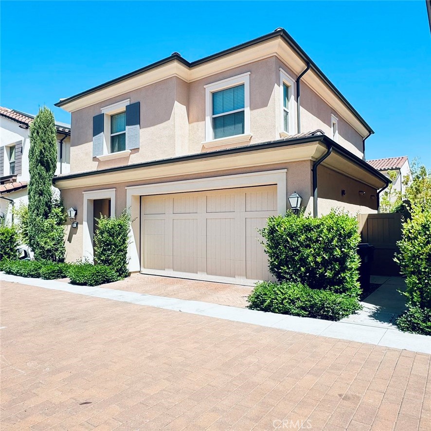 66 Darby Irvine, CA 92620 - Photo 3 of 3 a front view of a house with a yard and garage