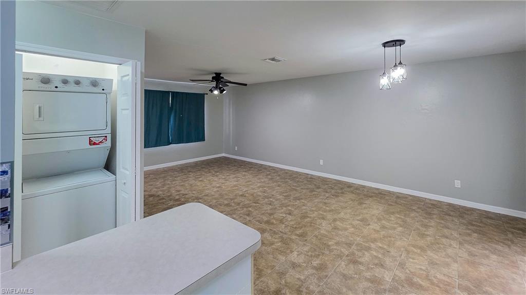 7319 Albany Road Fort Myers, FL 33967 - Photo 9 of 27 wooden floor in an empty room with a bathroom