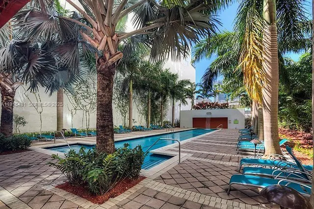 a backyard of a house with outdoor seating