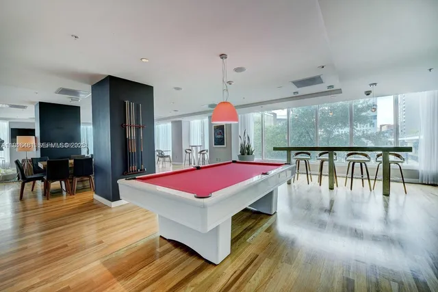 a room with gym equipment and a large window