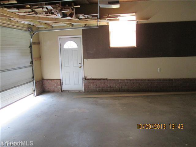7802 Athens Road Stokesdale, NC 27357 - Photo 14 of 16 Parking Lot/Garage. 2 car attached garage.