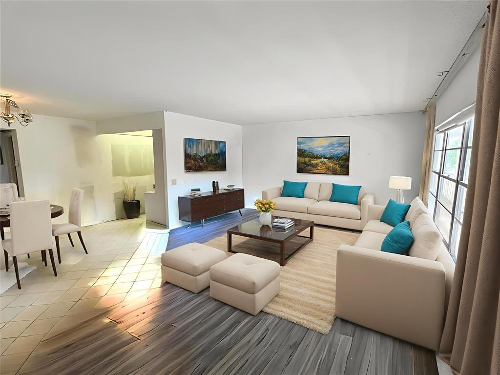 2029 Cambridge B, Unit 2029 Deerfield Beach, FL 33442 - Photo 11 of 36 a living room with furniture and a flat screen tv