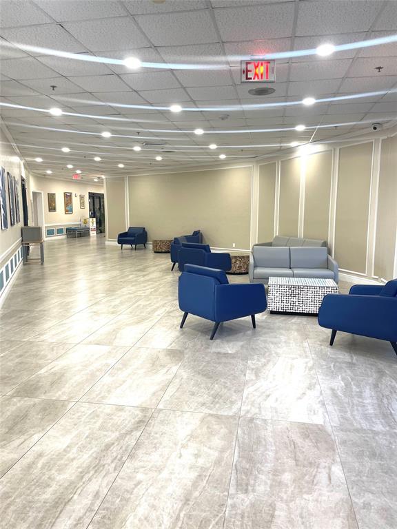 2029 Cambridge B, Unit 2029 Deerfield Beach, FL 33442 - Photo 26 of 36 a lobby with a couch and stairs