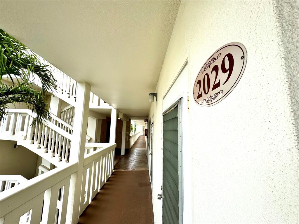 2029 Cambridge B, Unit 2029 Deerfield Beach, FL 33442 - Photo 4 of 36 a view of a hallway with entryway