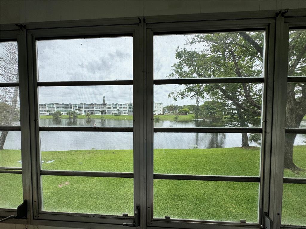 2029 Cambridge B, Unit 2029 Deerfield Beach, FL 33442 - Photo 10 of 36 a bathroom with a large window