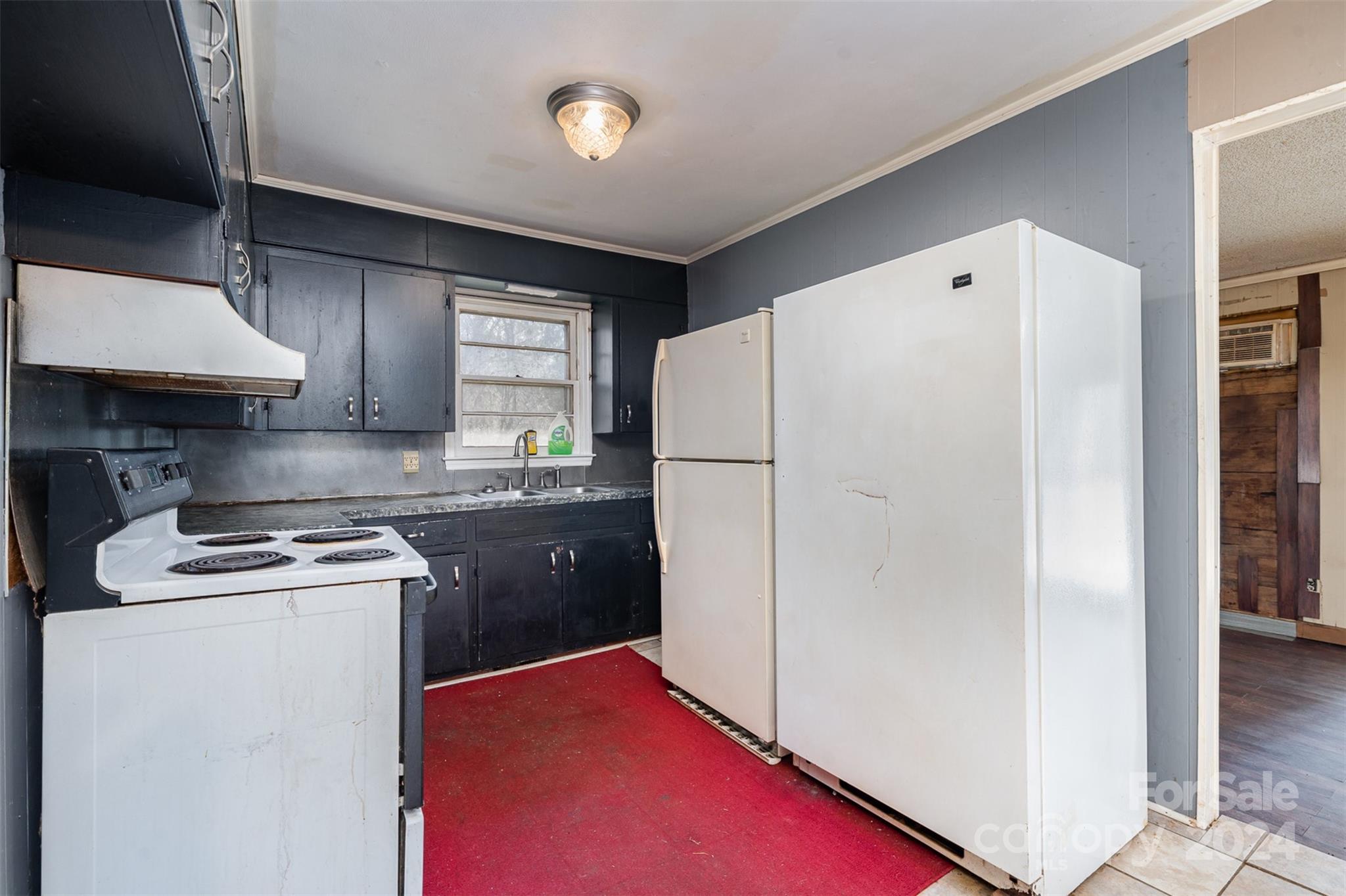 128 Paul Snipes Road Lancaster, SC 29720 - Photo 11 of 27 a kitchen with a refrigerator sink stove and cabinets