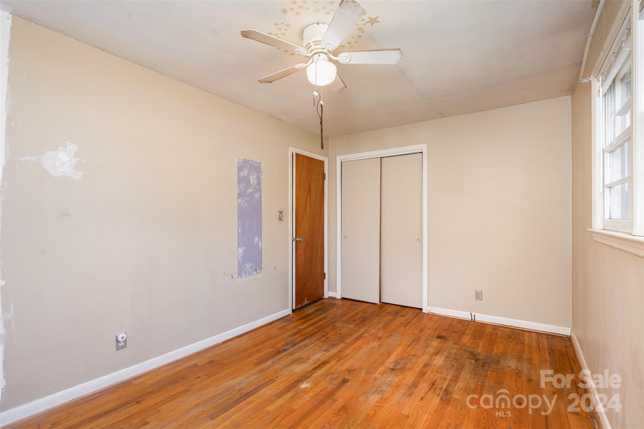 128 Paul Snipes Road Lancaster, SC 29720 - Photo 14 of 27 a view of empty room with wooden floor and fan