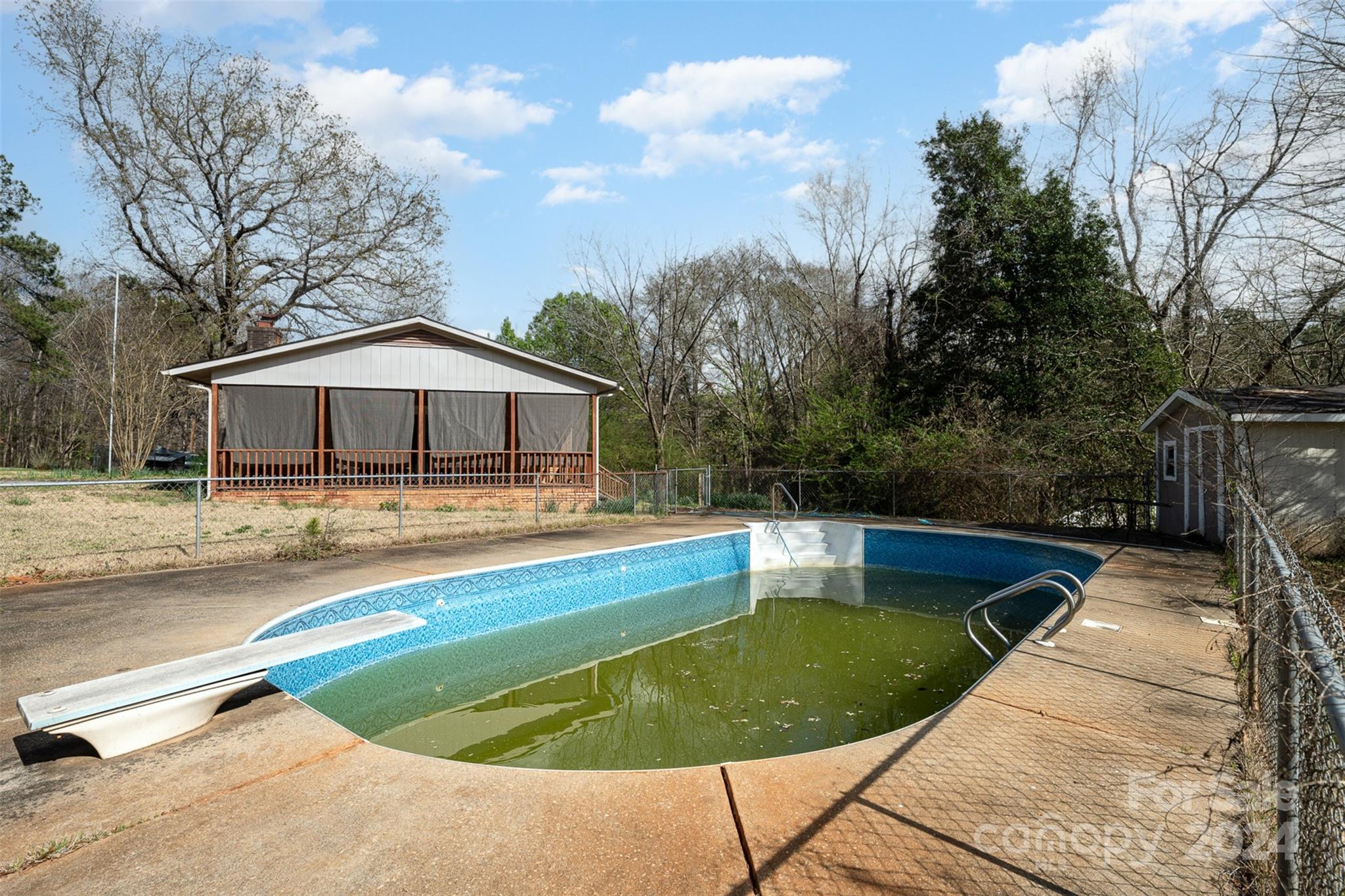 128 Paul Snipes Road Lancaster, SC 29720 - Photo 24 of 27 a view of a house with pool and trees