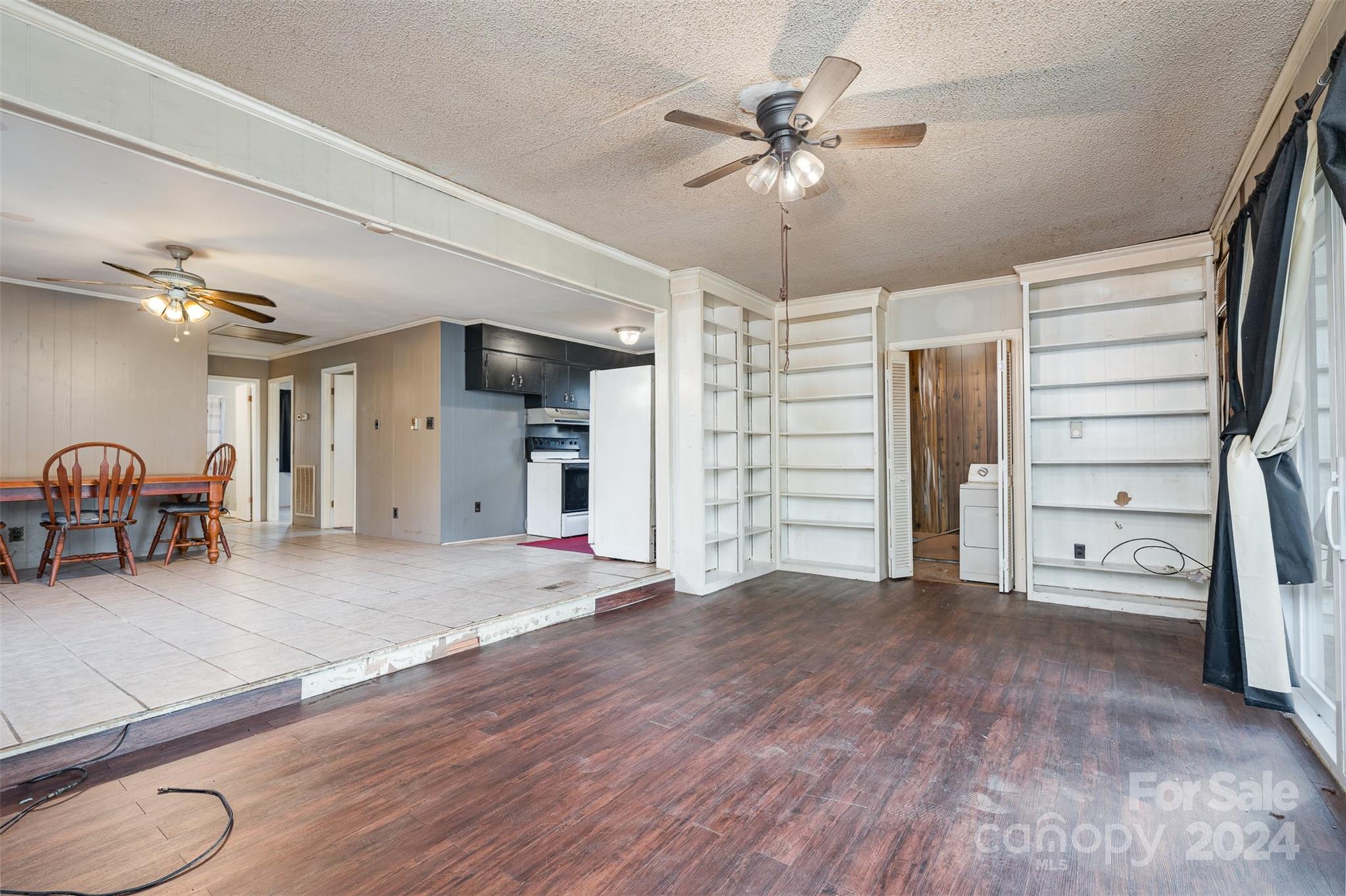 128 Paul Snipes Road Lancaster, SC 29720 - Photo 10 of 27 a view of livingroom with hardwood floor and a ceiling fan