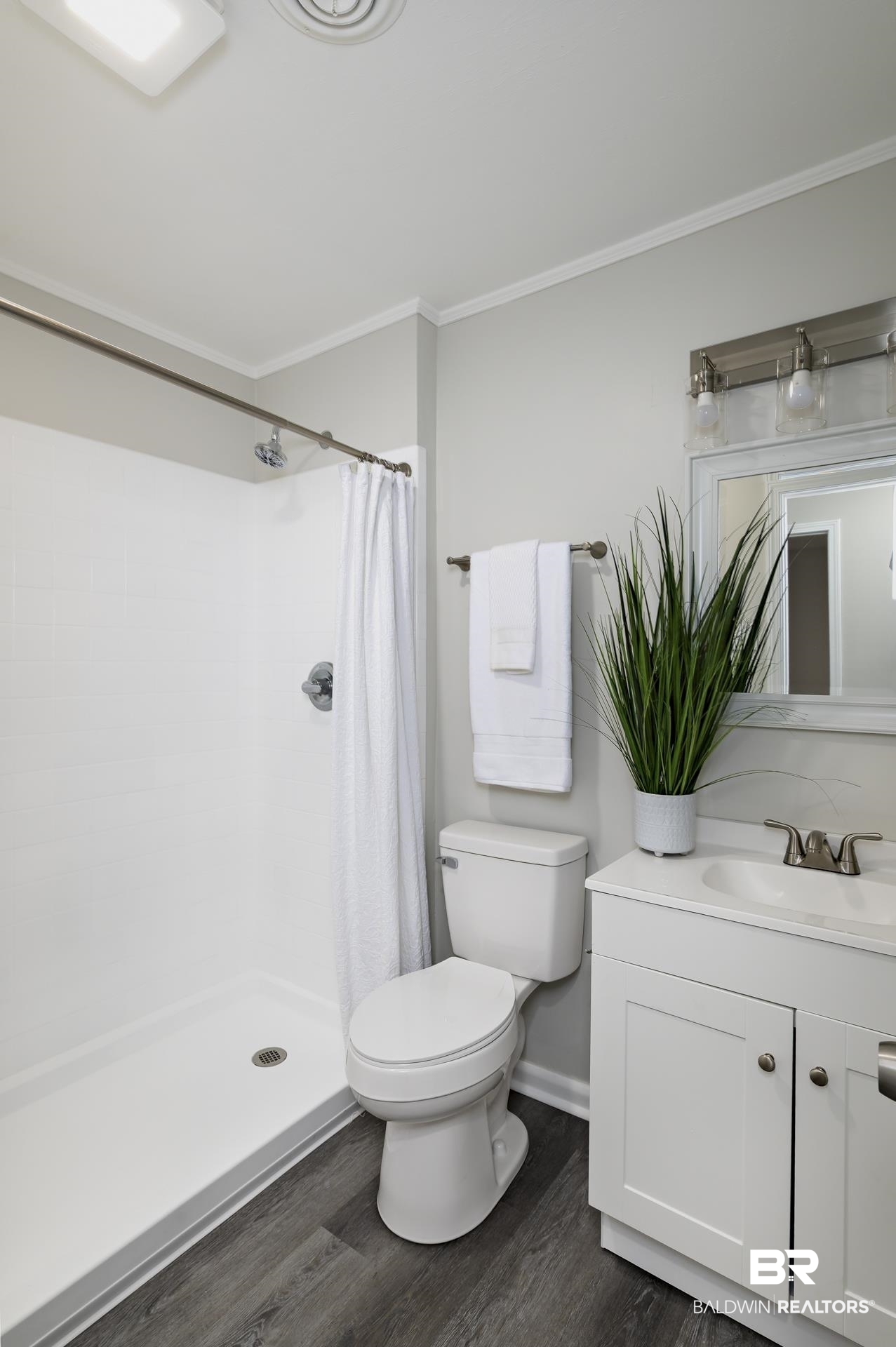 5922 Sunnyside Drive Mobile, AL 36619 - Photo 39 of 51 Full bath with crown molding, wood finished floors, toilet, a shower with shower curtain, and vanity
