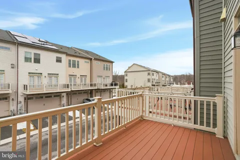 a view of a balcony with wooden floor