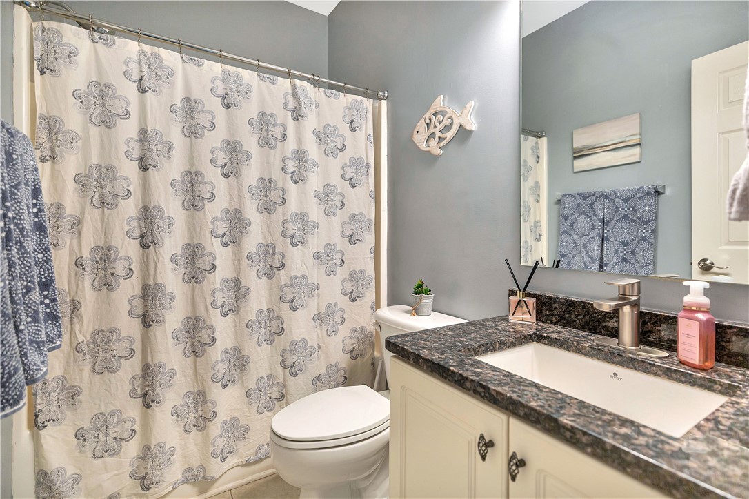 101 Riviera Circle Anderson, SC 29621 - Photo 22 of 35 This bright bathroom features a vanity with granite counters and a shower.