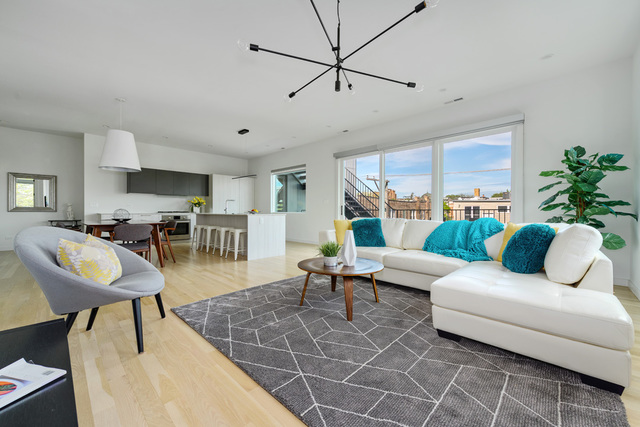 2016 West Rice Street, Unit 301 Chicago, IL 60622 - Photo 14 of 28 a living room with furniture kitchen view and a large window