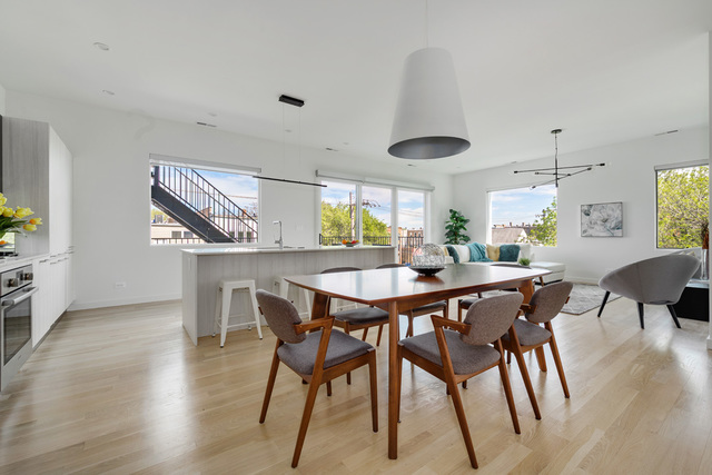 2016 West Rice Street, Unit 301 Chicago, IL 60622 - Photo 4 of 28 a view of a dining room with furniture and wooden floor