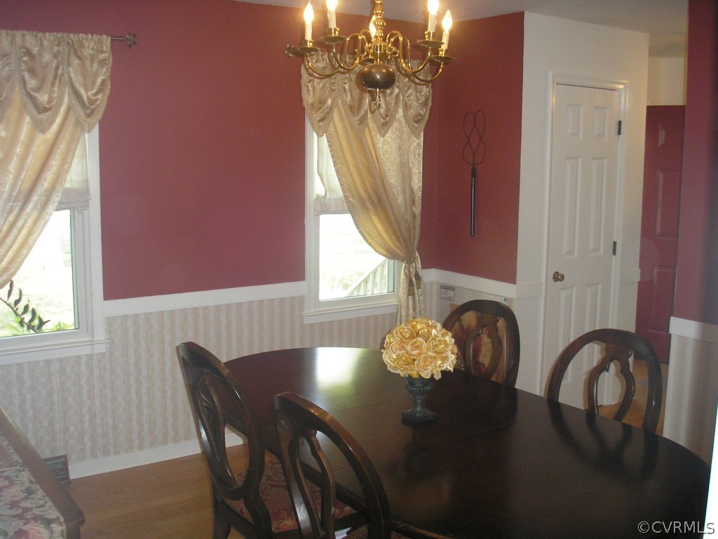 418 Walton Park Road Midlothian, VA 23114 - Photo 3 of 24 a view of a dining room with furniture and chandelier
