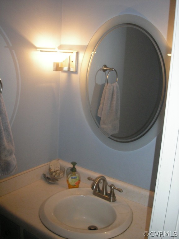 418 Walton Park Road Midlothian, VA 23114 - Photo 10 of 24 a bathroom with a sink and mirror
