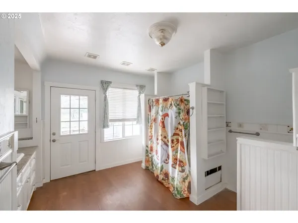 a view of a livingroom with furniture and a window