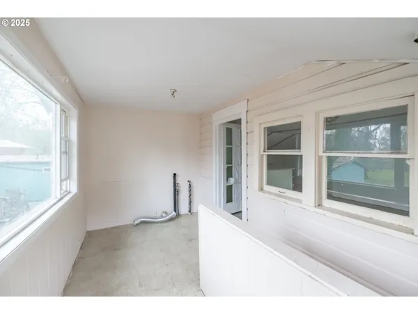 a view of an empty room with a window