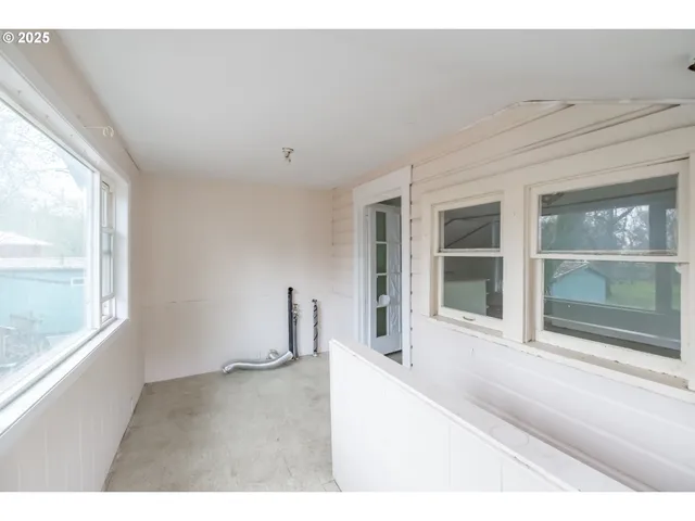 a view of an empty room with a window