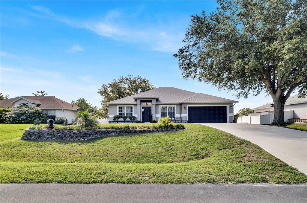 2919 Foraker Way Kissimmee, FL 34758 - Photo 1 of 1 a front view of a house with a yard