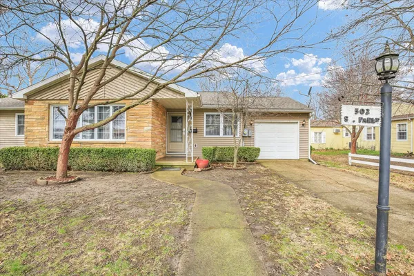 a view of a house with a snow in the yard
