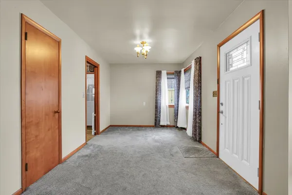 a view of a hallway with closet area