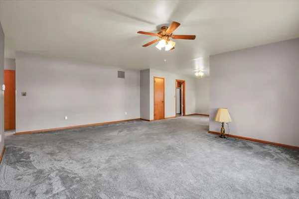 a view of a livingroom and a fireplace