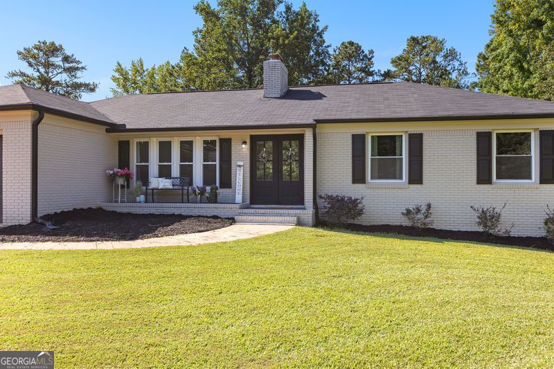 a front view of a house with swimming pool