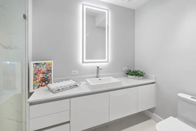 a kitchen with a sink and a refrigerator