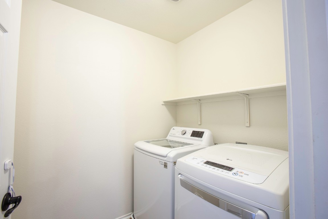 11412 Barns Trail Austin, TX 78754 - Photo 15 of 20 Laundry room with washer and dryer