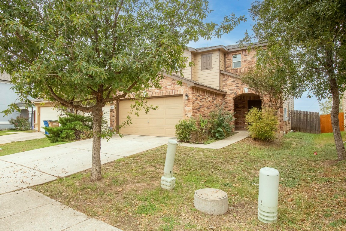 11412 Barns Trail Austin, TX 78754 - Photo 2 of 20 View of front of property with brick siding and driveway